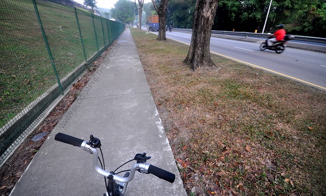 Just Right: A simple 1.5m width pedestrian path way with solid covered drain openings in Woodlands, Singapore can be used for cycling too.